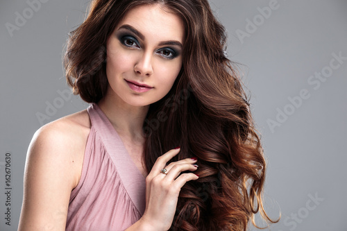 closeup beauty portrait of young woman with natural makeup and hairstyle. spa and care.