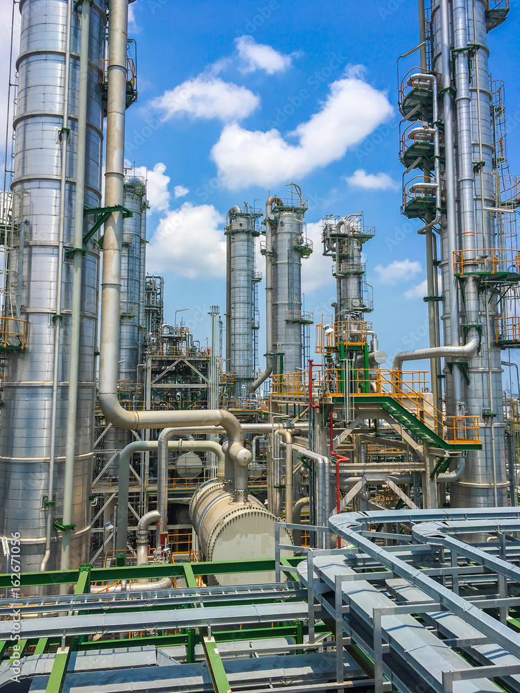 The equipment of oil refining in process area ,Close up of industrial pipelines of an oil refinery plant The equipment of oil refining in process area ,Close up of industrial pipelines of an oil refinery plant