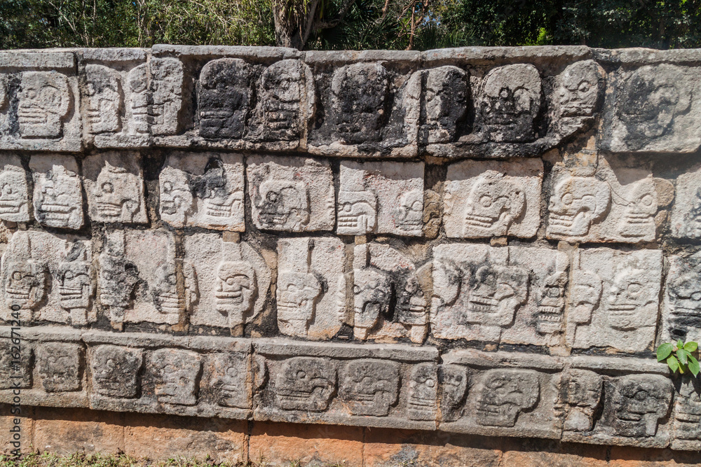 Carveed skulls at the Platform of Sculls at the archeological site Chichen Itza, Mexico Carveed skulls at the Platform of Sculls at the archeological site Chichen Itza, Mexico