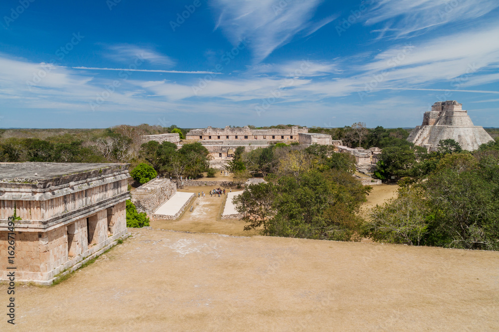 Nun's Quadrangle (Cuadrangulo de las Monjas) building complex and the Pyramid of the Magician (Piramide del adivino) at the ruins of the ancient Mayan city Uxmal, Mexico Nun's Quadrangle (Cuadrangulo de las Monjas) building complex and the Pyramid of the Magician (Piramide del adivino) at the ruins of the ancient Mayan city Uxmal, Mexico