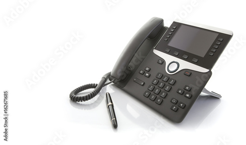 Modern Business Office IP Telephone with pen on a white background photo