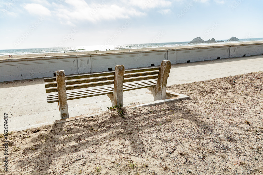 stone bench overlooking beach