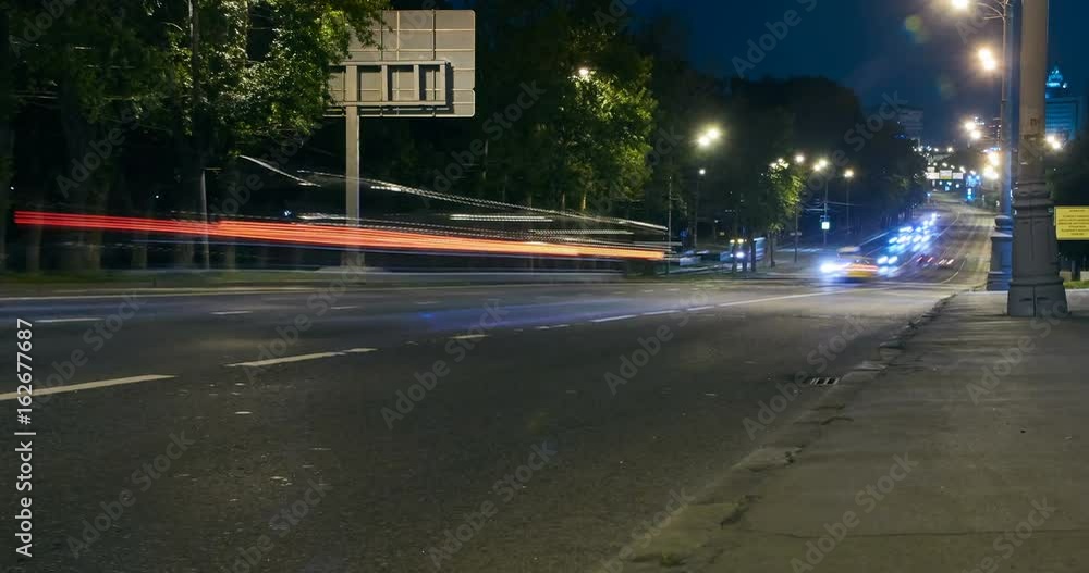 Timelapse video of automobile traffic on a city street in the night Timelapse video of automobile traffic on a city street in the night