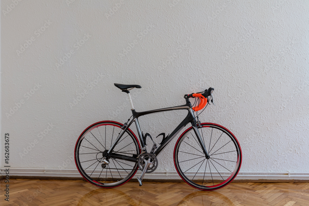 Naklejka premium Race bike next to white wall