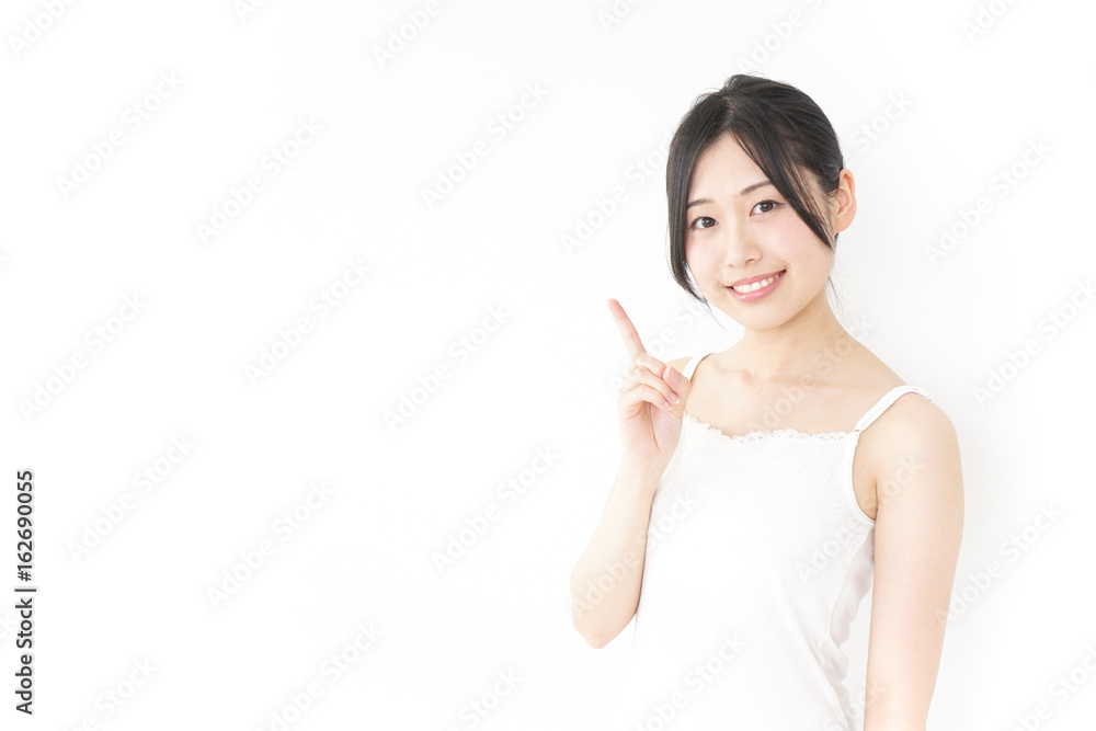 Young woman pointing something with smile Young woman pointing something with smile