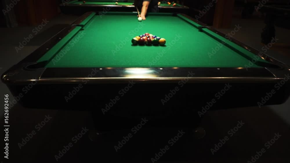 Table Pool Hit Playing billiards, blowing a cue on the ball, the ball hit the pocket ...