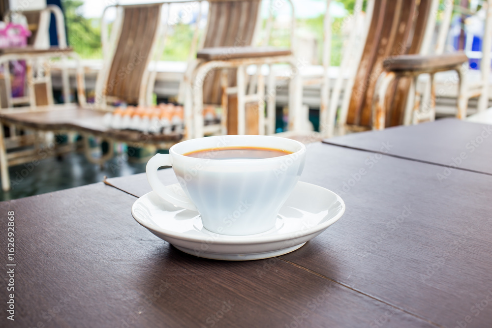 Coffee cup with milk on the table Coffee cup with milk on the table