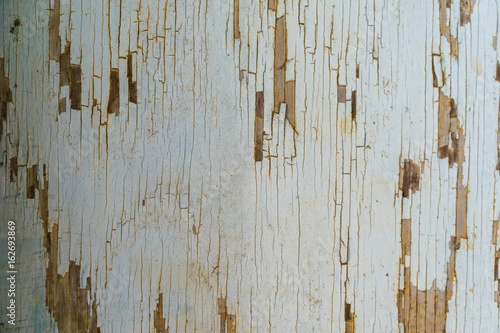 Chipped paint on the side of a buildling