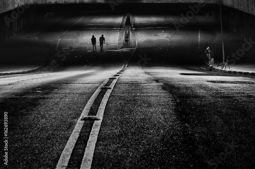 silhouette couple walking on the street