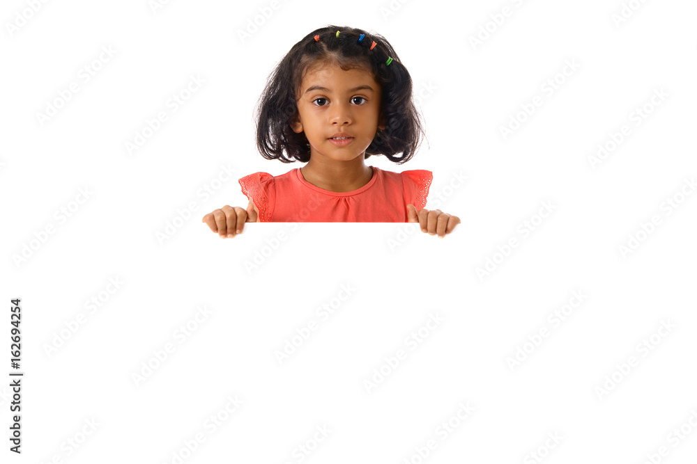 Portrait of little girl in studio with white board.Isolated Portrait of little girl in studio with white board.Isolated