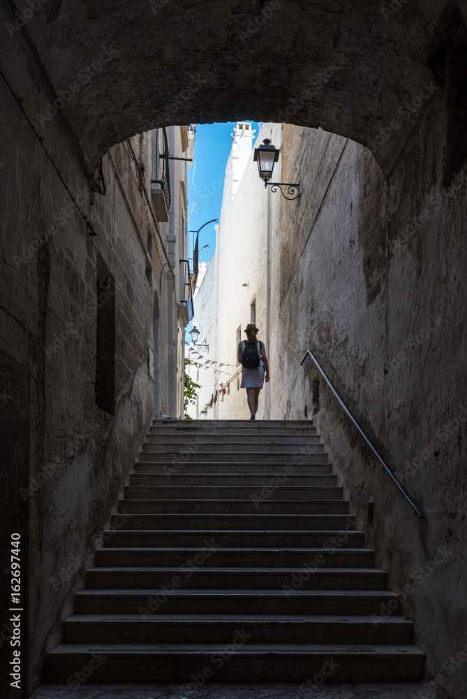 Fototapeta premium Polignano a Mare (Puglia, Italy) - The famous sea town in province of Bari, southern Italy. The village rises on rocky spur over the Adriatic Sea, and is known tourist attraction.