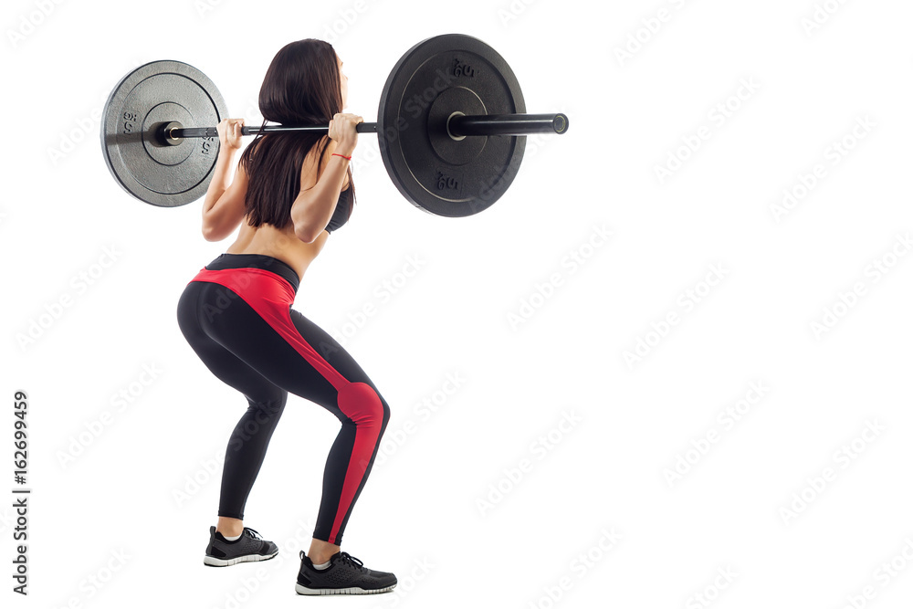 Woman doing squat with a barbell Woman doing squat with a barbell