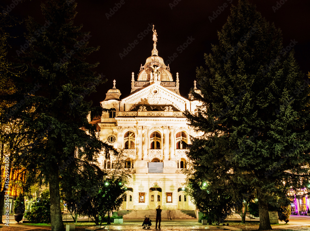 State theater in Kosice, Slovakia, night photo, yellow filter
