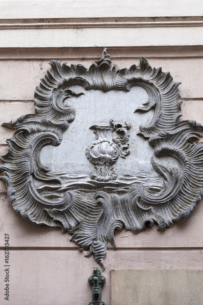 Relief on facade of old building, decorative vase, Prague, Czech Republic