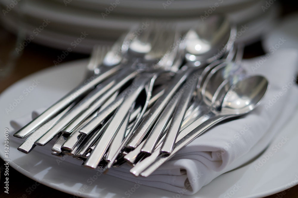 dish spoon fork on table at restaurant dish spoon fork on table at restaurant