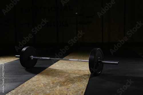 Barbell lying in the gym