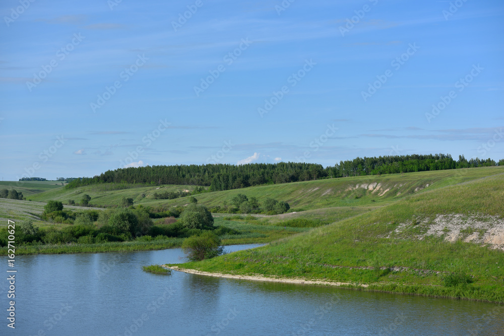 Beautiful scenery with water, hills and forest