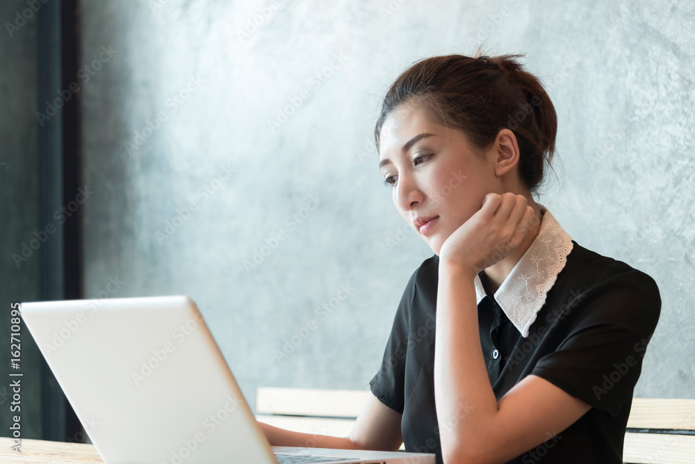 Beautiful asian woman working with tablet computer in the room. Beautiful asian woman working with tablet computer in the room.