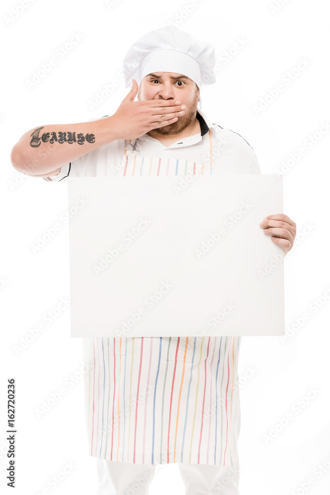 chef covering mouth with hand while holding blank banner isolated on white chef covering mouth with hand while holding blank banner isolated on white