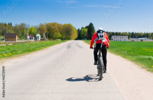 Fototapeta Naklejka Na Ścianę i Meble -  cyclist riding a bicycle. Cycling, active rest, healthy lifestyle