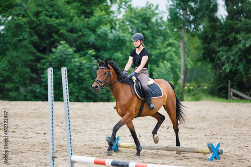 Horse rider is training in the arena