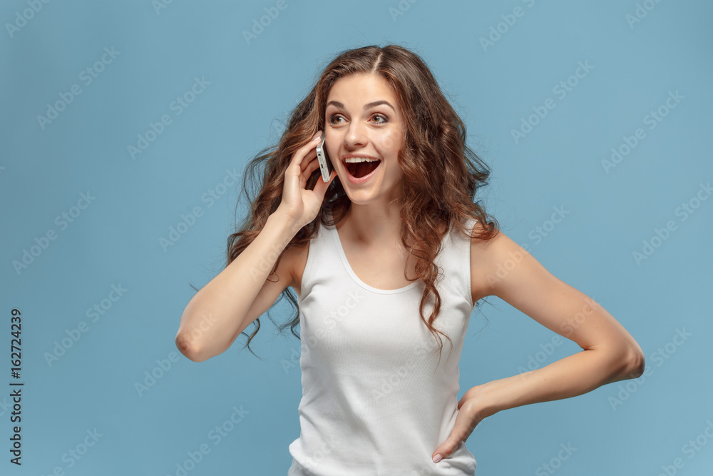 The young woman's portrait with happy emotions The young woman's portrait with happy emotions