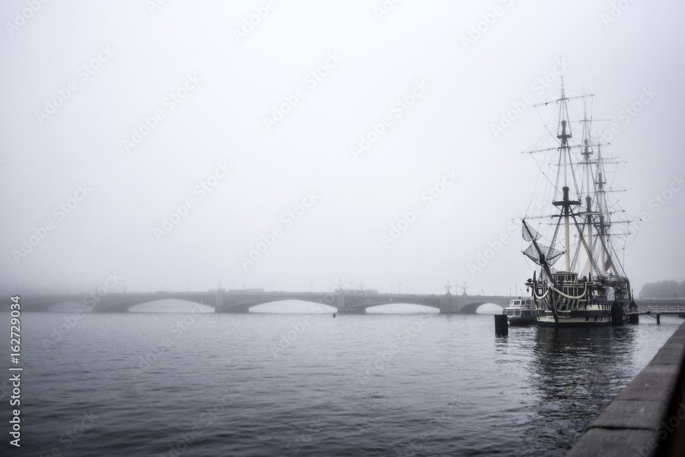 An old ship in a fog i neva river, Petersburg, Russia. An old ship in a fog i neva river, Petersburg, Russia.