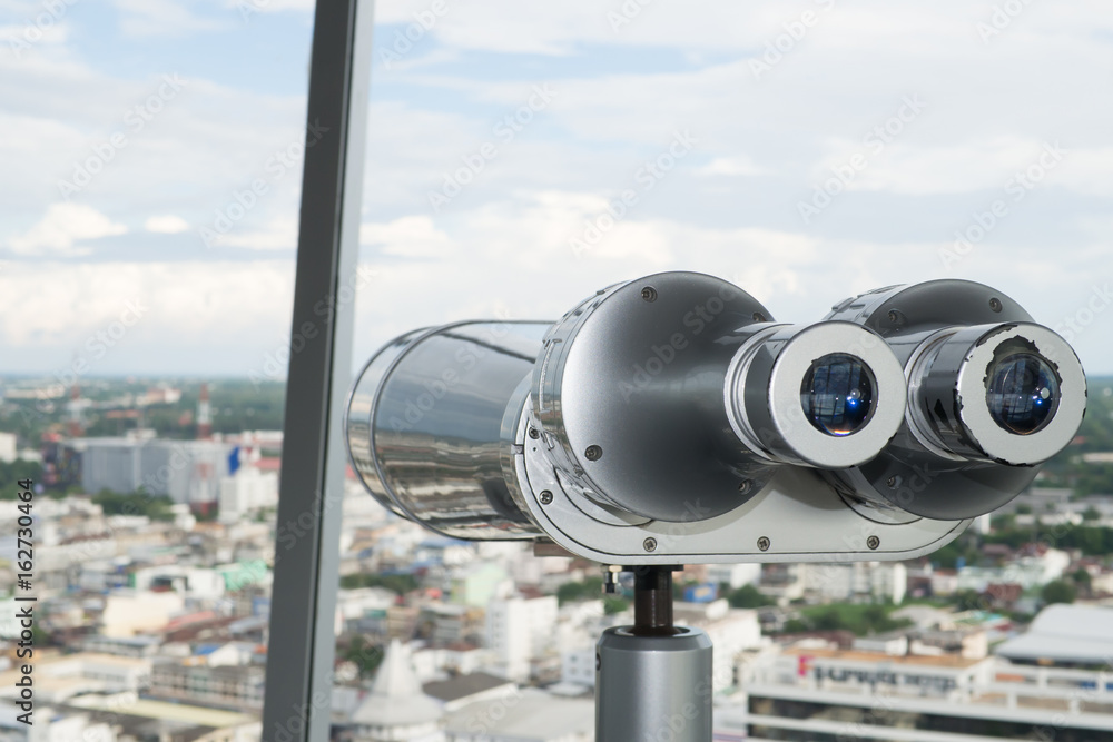 Binocular to the view at the height building