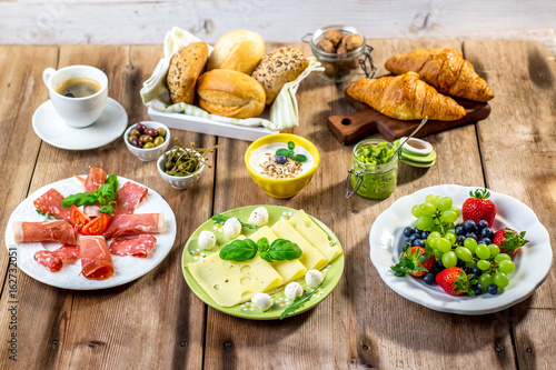 Breakfast served with fruit, croissants,cheese and sausage