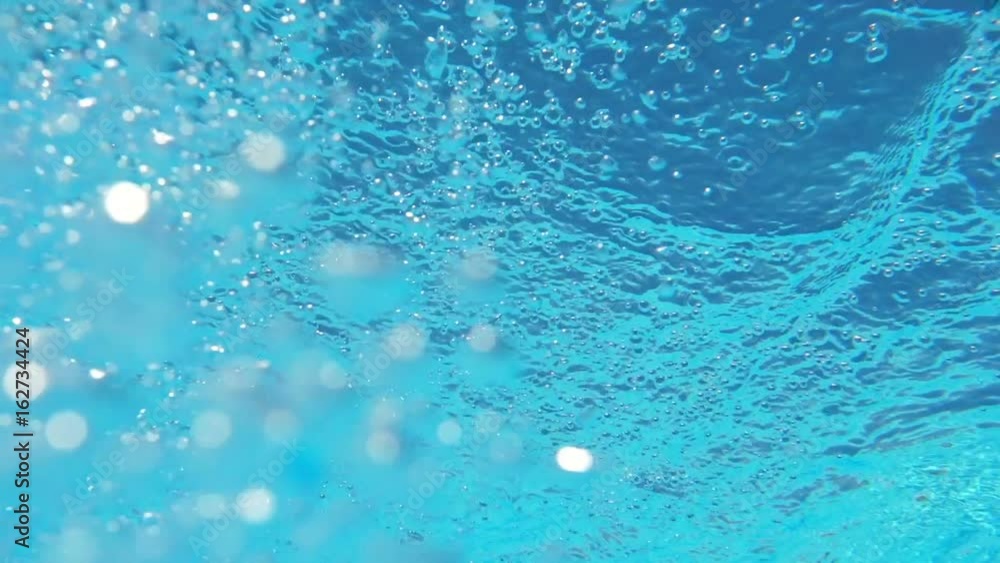 Bubbles rising to the surface. Slow motion. Air bubbles in clear blue water in pool (underwater shot), good for backgrounds
Bubbles rising to the surface. Slow motion. Air bubbles in clear blue water in pool (underwater shot), good for backgrounds
