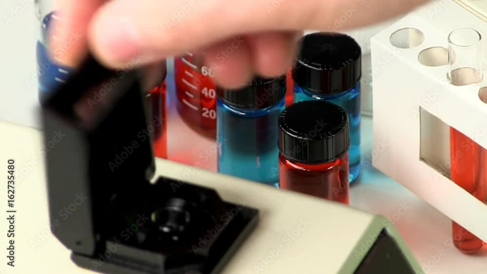 Cuvette of blue liquid placed in cuvette holder inside