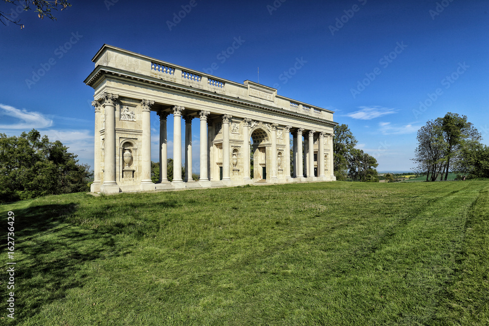 Rajstna colonnade in the middle of the grass field