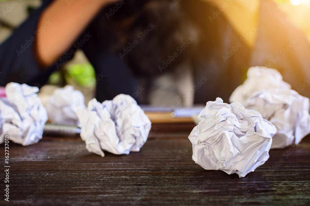 Businessmen stress and Fear Crushed paper on wood table Businessmen stress and Fear Crushed paper on wood table
