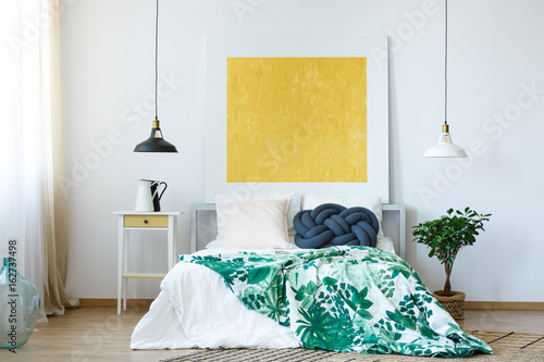 Yellow painting in bedroom photo