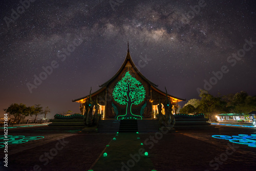Temple Sirindhorn Wararam Phuproud in Ubon Ratchathani Province at night and The Milky Way is our galaxy. This long exposure astronomical