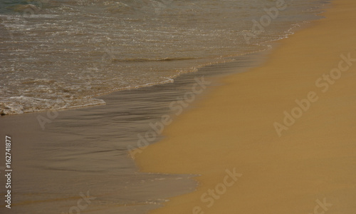 Golden sand of beach, coastline close-up