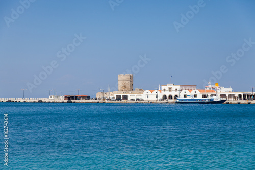 Wallpaper Mural Harbor and monuments in Rhodes. Old defensive stands and windmills. Wharf harbors, boats and sailing ships. Historic harbor, pier and beach. Torontodigital.ca