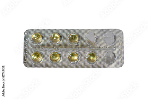 One started foil package with pills isolated on white background photo