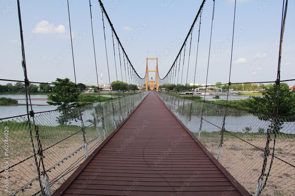 Obraz premium Yellow Suspension Bridge Architecture With doors blocking the passage that can pass through. Which is considered to be very popular.