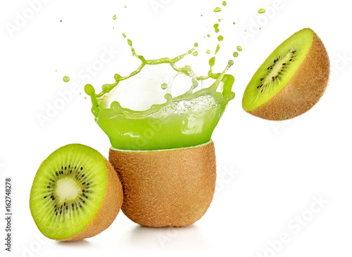 juice exploding out of a kiwi fruit isolated on white