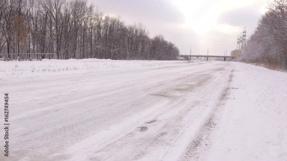 Frozen empty winter road. Empty road with snow covered landscape. Beautiful winter seasonal background for transport and cars. Frozen empty winter road. Empty road with snow covered landscape. Beautiful winter seasonal background for transport and cars.