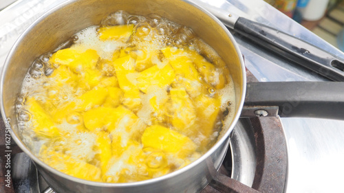 To boiling pumpkin of Thai dessert in pot
