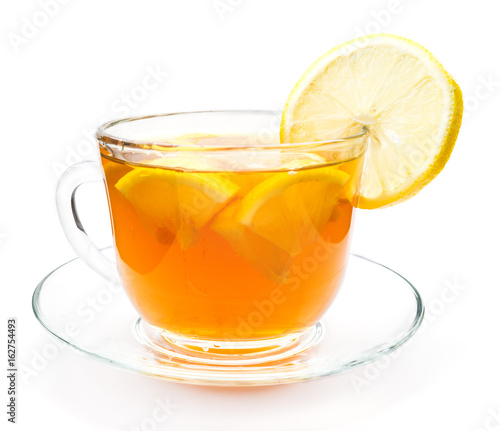 Isolated transparent cup of tea with lemon slice
