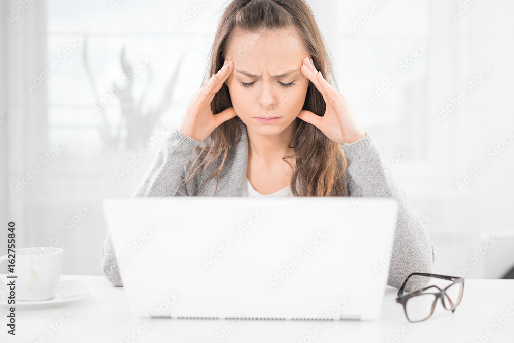 Young woman is tired and feels stressed out. Young woman is tired and feels stressed out.