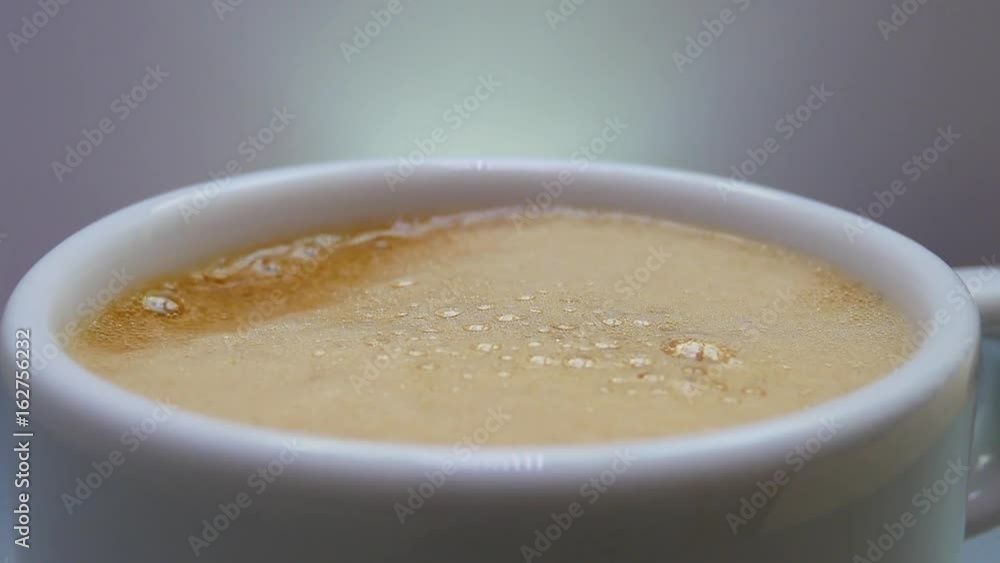 Isolated Foam Brown Drink with Air Bubbles in a White Cup or Glass. Releasing Bubbles and Foaming. Pouring Soda. Brown Foaming Drink Kvass or Beer in White Glass Isolated Foam Brown Drink with Air Bubbles in a White Cup or Glass. Releasing Bubbles and Foaming. Pouring Soda. Brown Foaming Drink Kvass or Beer in White Glass