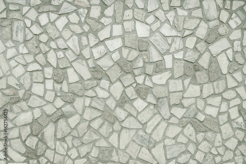 Old grey mosaic wall background texture
