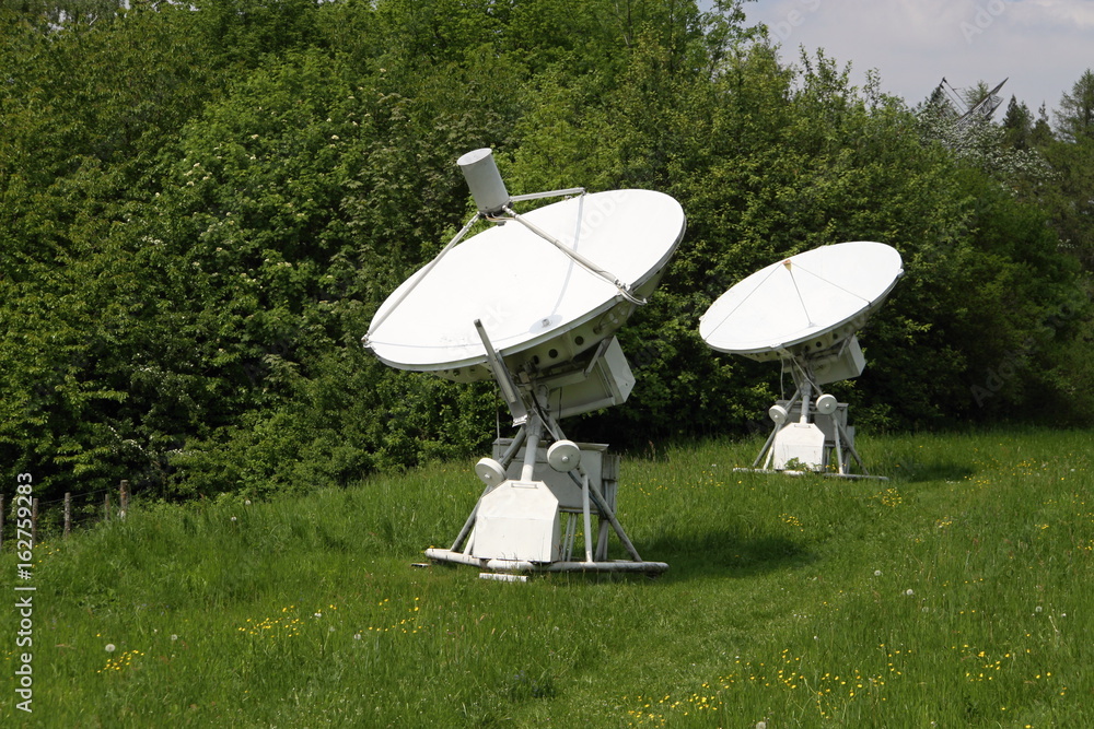 Pair of white radio telescope antennas