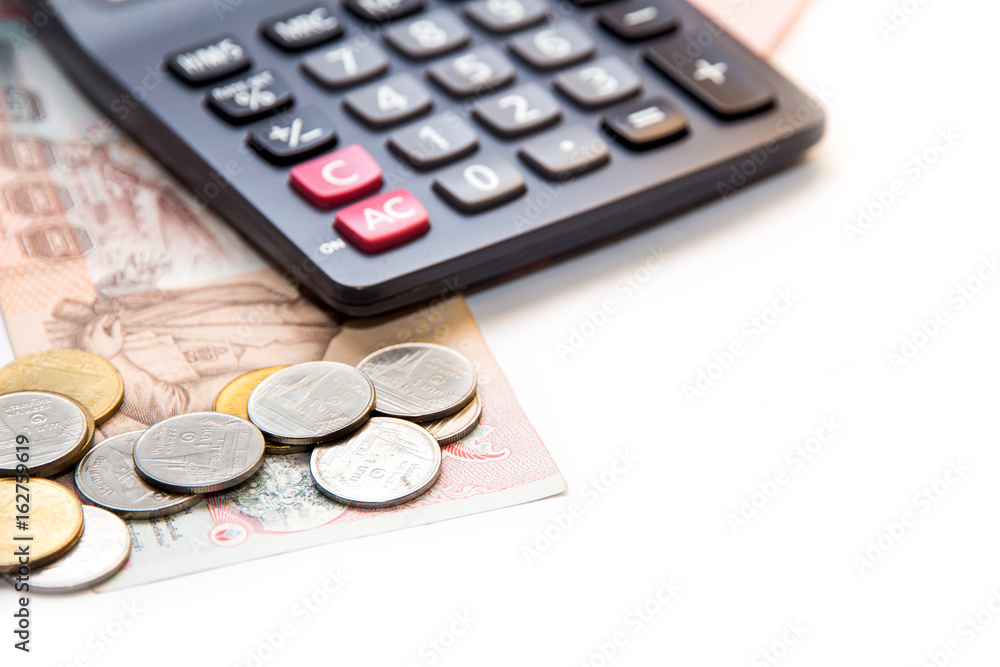 Thai banknotes and calculator on white background Thai banknotes and calculator on white background