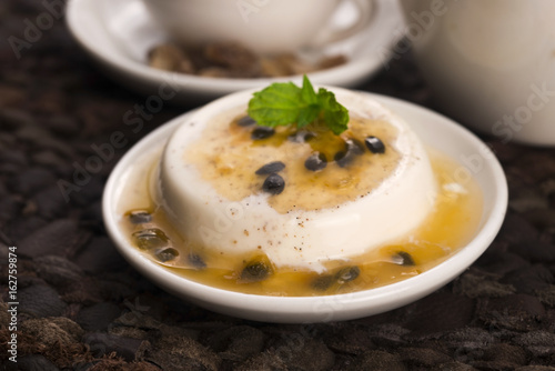 Panna cotta dessert with passion fruit and mint