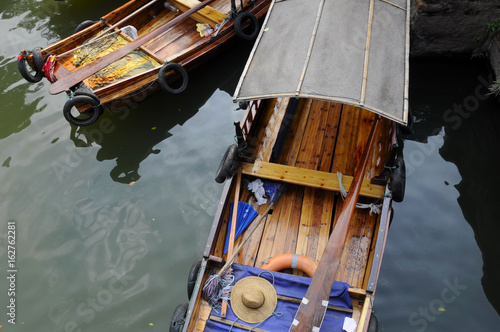 Tourist boats on the water canals of tongli town in zhejiang province china. photo